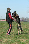 man and German Shepherd
