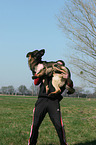 man and German Shepherd
