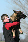 man and German Shepherd