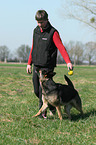 man and German Shepherd