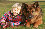 child and German Shepherd