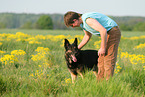 man and German Shepherd