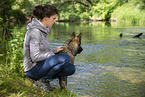 woman and GDR Shepherd