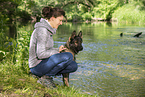 woman and GDR Shepherd