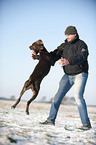 man and German shorthaired Pointer