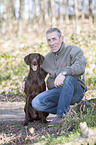 man and German shorthaired Pointer