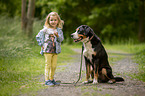 young girl with Greater Swiss Mountain Dog