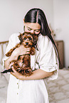 young woman with young havanese