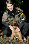 girl with Hovawart Puppy