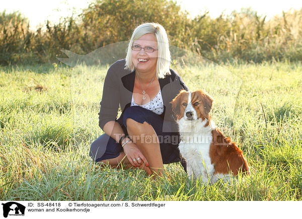 woman and Kooikerhondje / SS-48418