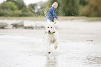 woman and Labradoodle