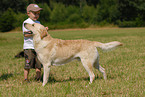 boy and labrador retriever