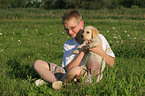 boy and Labrador Retriever Puppy