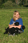 girl with Labrador Retriever Puppies