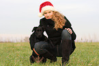 woman with young Labrador Retriever