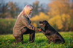 woman and Labrador Retriever