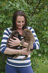 woman with Labrador Retriever Puppies