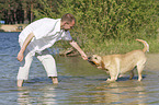 man with Labrador Retriever