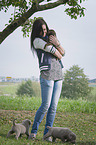 woman with Labrador Retriever Puppies