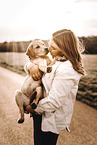 woman and Labrador Retriever Puppy