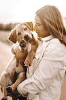 woman and Labrador Retriever Puppy