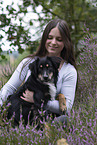 young woman with Miniature Australian Shepherd