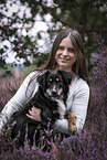 young woman with Miniature Australian Shepherd