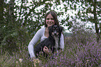 young woman with Miniature Australian Shepherd