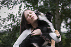 young woman with Miniature Australian Shepherd