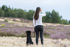 young woman with Miniature Australian Shepherd