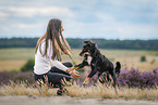 young woman with Miniature Australian Shepherd