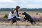 young woman with Miniature Australian Shepherd