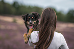 young woman with Miniature Australian Shepherd