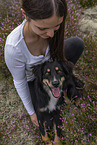 young woman with Miniature Australian Shepherd