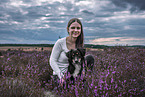 young woman with Miniature Australian Shepherd