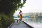 young woman with Miniature Australian Shepherd