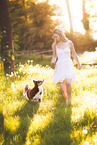 young woman with Miniature Australian Shepherd