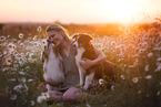 young woman with 2 Miniature Australian Shepherds