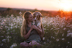 young woman with Miniature Australian Shepherd