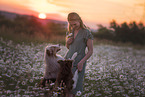 young woman with 2 Miniature Australian Shepherds