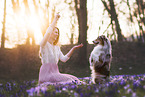 young woman with Miniature Australian Shepherd