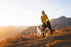 young woman with Miniature Australian Shepherd