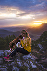 young woman with Miniature Australian Shepherd