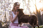 young woman with Miniature Australian Shepherd