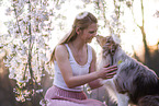 young woman with Miniature Australian Shepherd