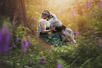 young woman with Miniature Australian Shepherd