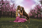 young woman with Miniature Australian Shepherd