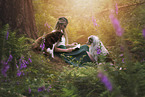 young woman with 2 Miniature Australian Shepherds