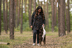 woman and Miniature Australian Shepherd