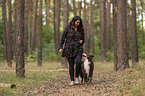 woman and Miniature Australian Shepherd